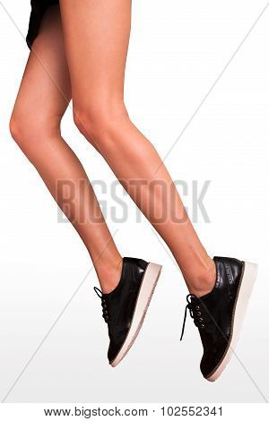 woman long legs in brogue shoes