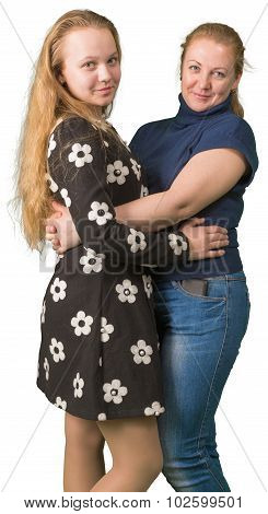 Mother and teen daughter embracing