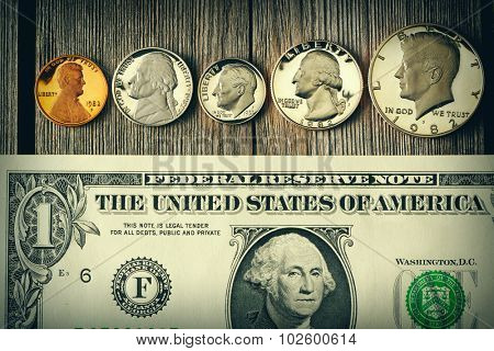 New uncirculated US money over wooden background
