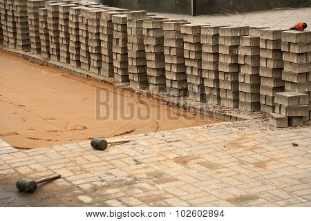 induration sand and laying paving slabs