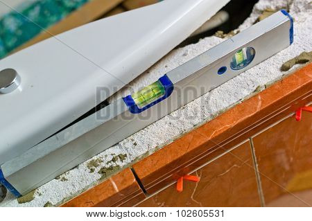 a spirit level on a construction site. symbol image for botched construction