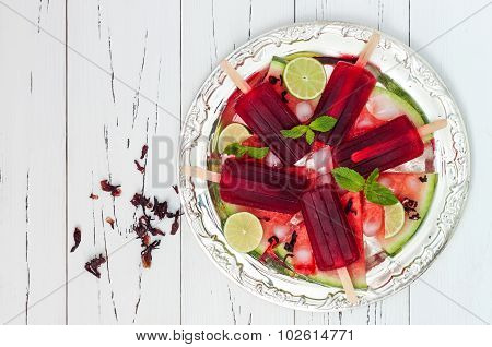 Refreshing mexican style ice pops - watermelon hibiscus lime paletas - ice pops - popsicles served o