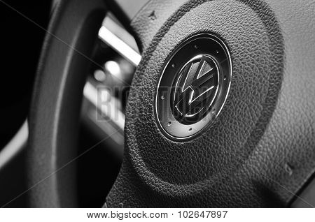 VW badge on a steering wheel