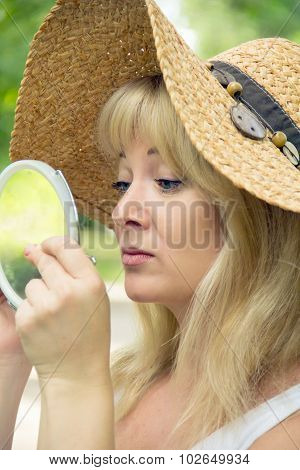 European Blond Woman In Straw Hat