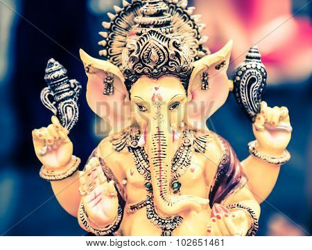 Yellow Ganesh Elephant Hindu God Statue Closeup Focused On Face