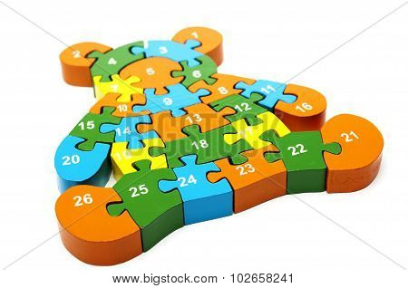 wooden colored puzzle in bear form with numbers