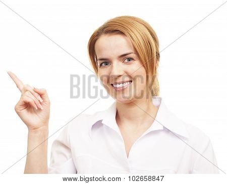 Young woman smiling and pointing to up