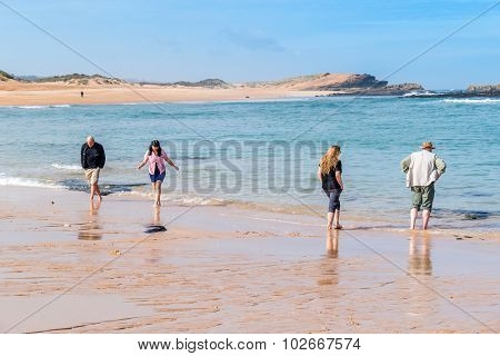 Tourist family on beach in Oualidia, Atlantic coast of Morocco