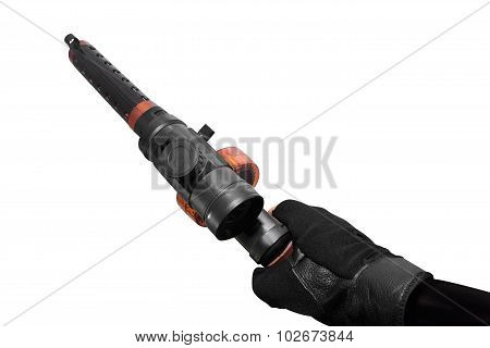 Isolated first person view hand holding automatic gun on white background upper view.