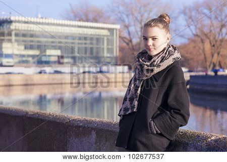 Pretty Caucasian Teenage Girl Posing Outdors In Trendy Black Coat.