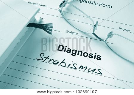 Diagnosis list with Strabismus and glasses.