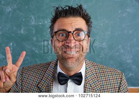 Nerd silly retro man teacher with braces funny expression winner victory finger gesture