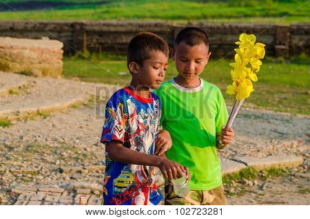 Sangkhlaburi Thailand - May 4 2014: Unidentified young asian Mon boy enjoying with friends at Old temple in SangkhlaburiThailand.