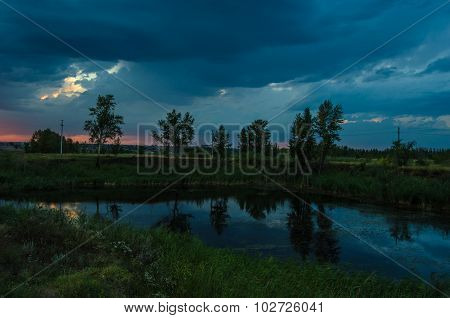 Sunset over calm lake