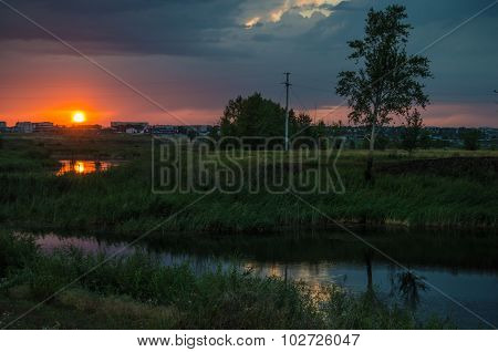 Sunset over calm lake