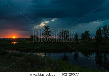 Sunset over calm lake