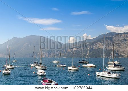 LAKE GARDA, ITALY - SEPTEMBER 2014 : Sailboats on The Garda Lake (Lago di Garda) in Italy on September 13, 2014. Lake Garda is the largest lake in Italya and one of popular places in the summer. 