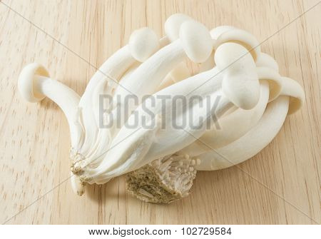 Raw Shimeji Mushroom On A Wooden Cutting Board