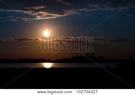 Sunset over calm lake