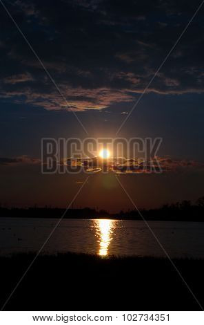 Sunset over calm lake