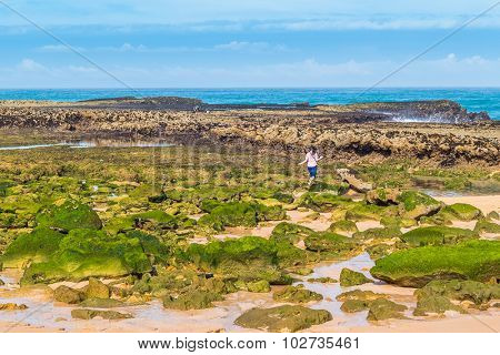 Girl visiting beach in Oualidia, Atlantic coast of Morocco