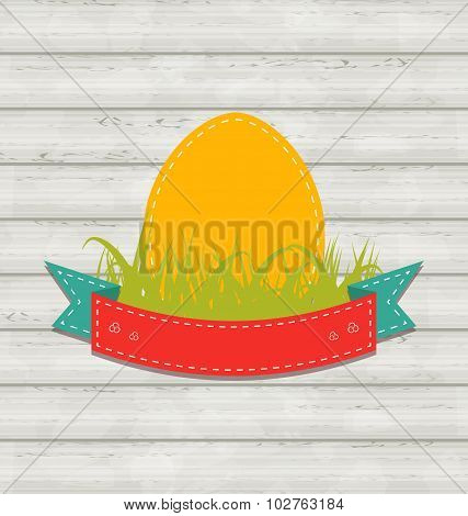 Vintage label with Easter egg on wooden background
