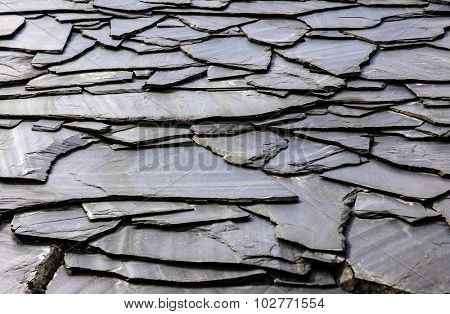 Rustic background of decorative black schist blades