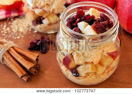 Overnight oats with apples and cranberries in a mason jar