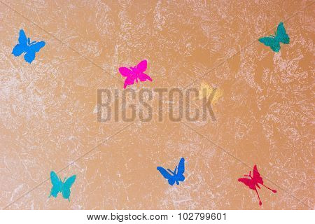 Beige Wall Painted With Textured Paint Roller With Butterflies
