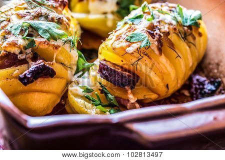Potato.Roasts potatoes. Home cooking roasts potatoes. Baking pan full of baked potatoes stuffed with