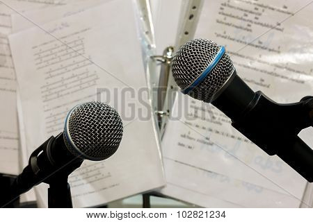 Selective Focus Bolt Microphone On The Blur Lyric Background.