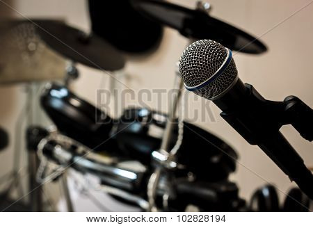 Microphone On Blur Drum Background And Vignetting.