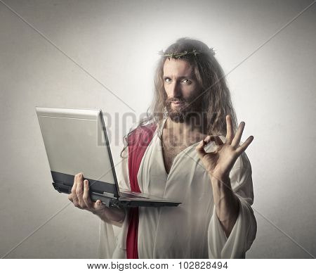 Jesus holding a pc