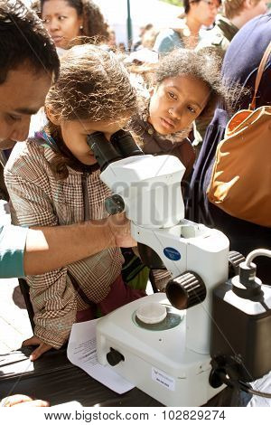 Young Student Looks Through Digital Microscope At Atlanta Science Fair