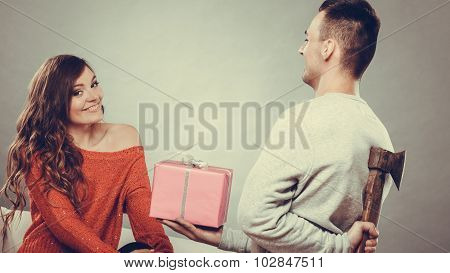 Insincire Man Holding Axe Giving Gift Box To Woman