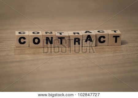 Contract In Wooden Cubes