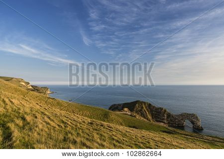 Stunning Natural Cove Coastal Landscape At Sunset With Beautiful Vibrant Sky