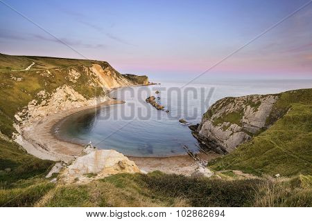 Stunning Natural Cove Coastal Landscape At Sunset With Beautiful Vibrant Sky