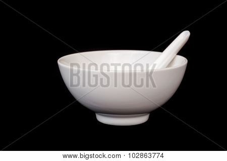 White Bowl With Spoon Isolated On Black Background