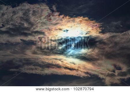 Setting Sun Cuts Through The Thick Clouds Colorful