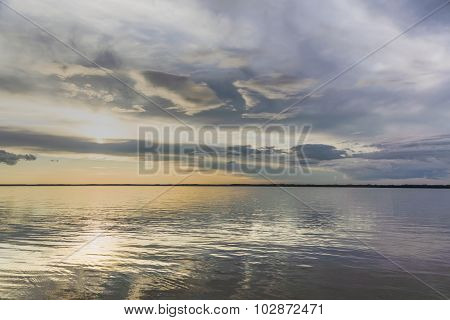 Sunset over the river expanse .