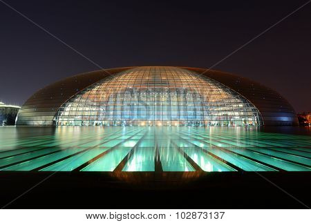 BEIJING, CHINA - APR 3: National Centre for the Performing Arts NCPA at night on April 3, 2013 in Beijing, China. Cost 2.8B CNY, it seats 5,452 people. The first performance was held in December 2007