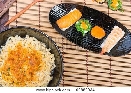 Sushi And Noodle In Black Dish
