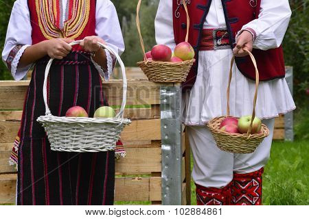 Oicture of a RESEN MACEDONIA. 27 SEPTEMBER 2015- Boy and girl in traditional clothes posing with apples during festival Prespa apple picking 2015 in Resen Macedonia