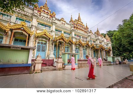 Buddhist nuns sweep the floor