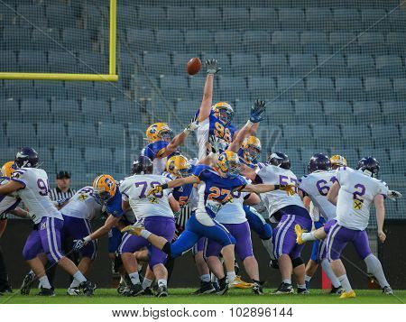 GRAZ, AUSTRIA - JUNE 27, 2014: K Christopher Kappel (#2 Vikings) kicks a PAT during an Austrian football league game.