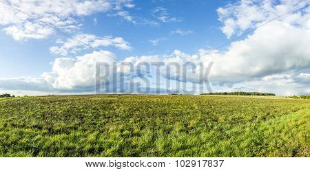 Rural Landscape With Fields And Clouds In Bright Sunset
