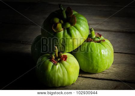 Still Life With Fresh Garcinia Cambogia On Wooden Background (thai Herb)