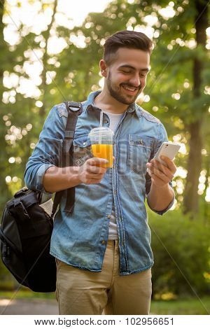 Hipster man walking in the park