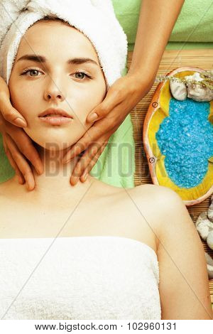 stock photo attractive lady getting spa treatment in salon, close up asian hands on face